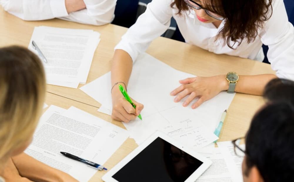 Learner presenting results to peers in a corporate training session