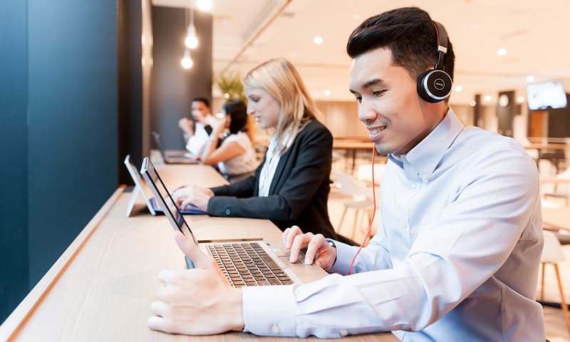 Man engaged in online learning using a laptop
