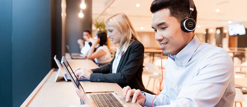Man engaged in online learning using a laptop